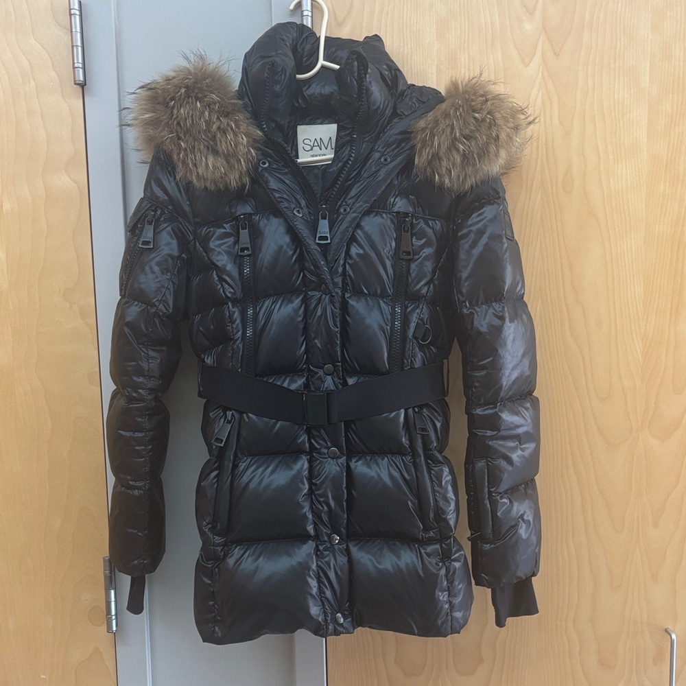 SAM. Women's Shiny Black Puffer Jacket with Fur and the belt.